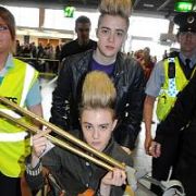 Exclusive Allround: Jedward twins John & Edward Grimes arrive at Dublin Airport Departures with Edward in a wheelchair and carrying gold crutches after his recent knee injury, Dublin Airport, Dublin, Ireland - 09.07.10. Pictures: VIPIRELAND.COM